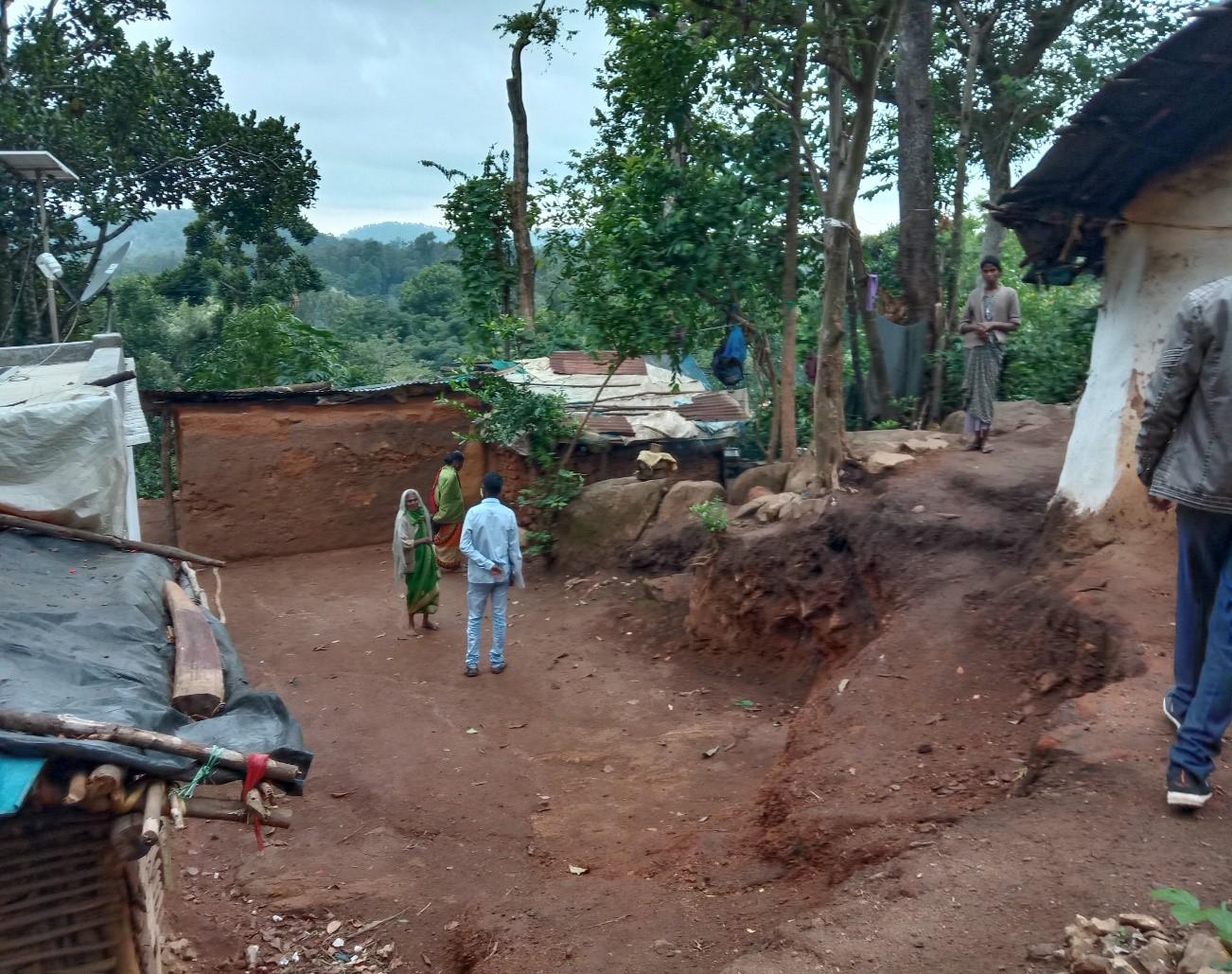 A village within forests where tribal people reside Glimpse of a village within forests where tribal people reside